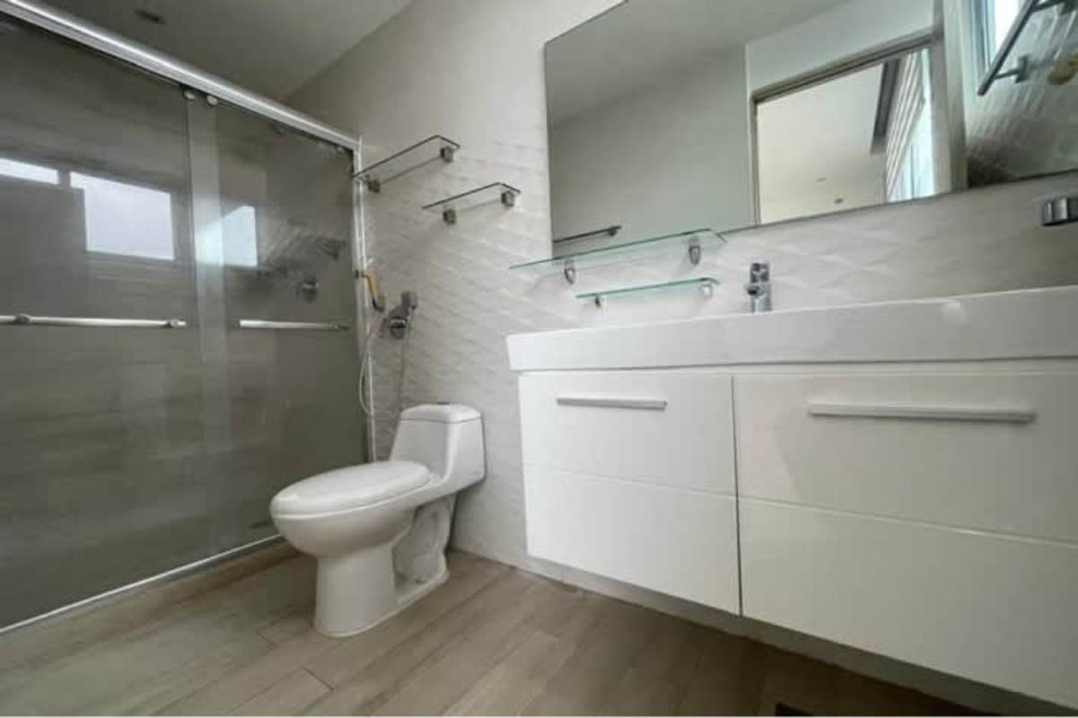 Covered balcony with safety glass railing and panoramic ocean and city skyline views in PH San Francisco Bay