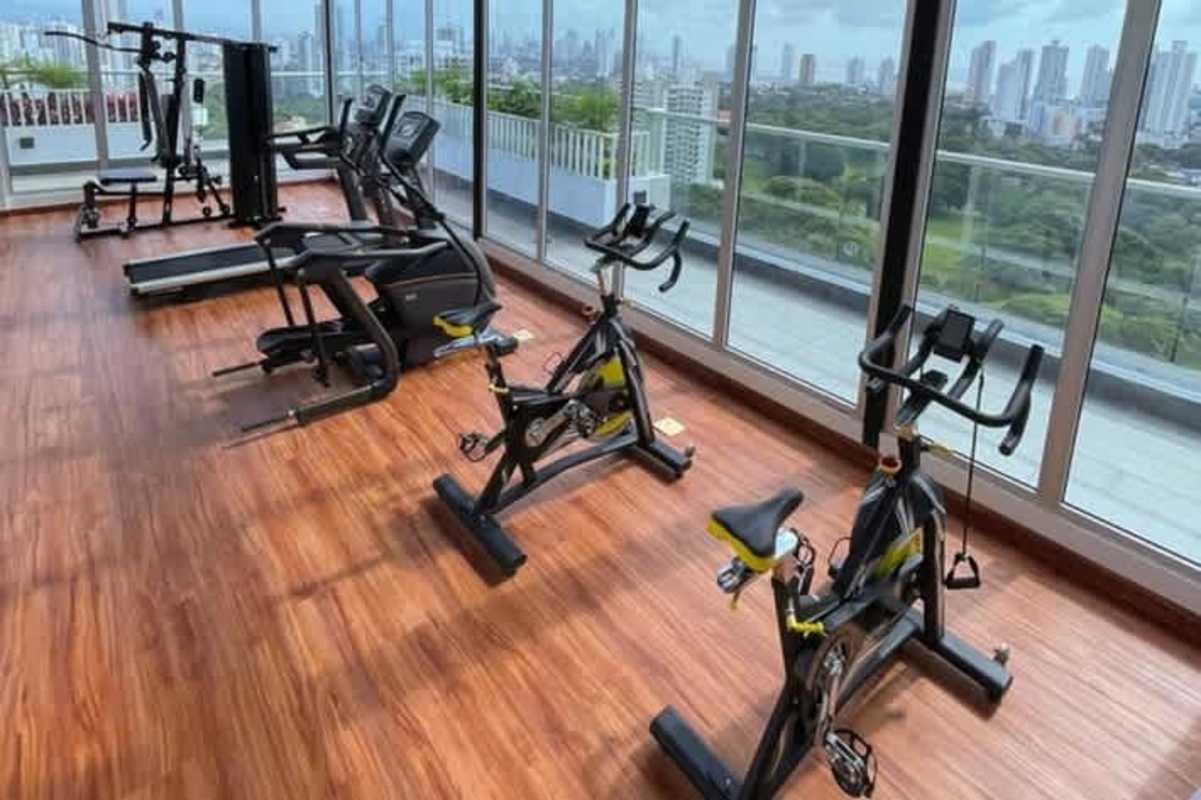 Modern fitness center with city skyline window vista Isabella Towers Panama City
