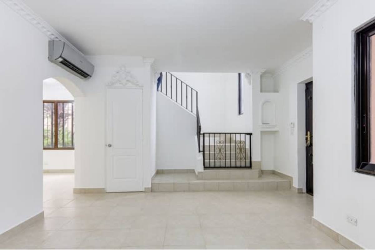 Large enclosed patio with arches, ceiling fans, tiled floor in Versalles Panama