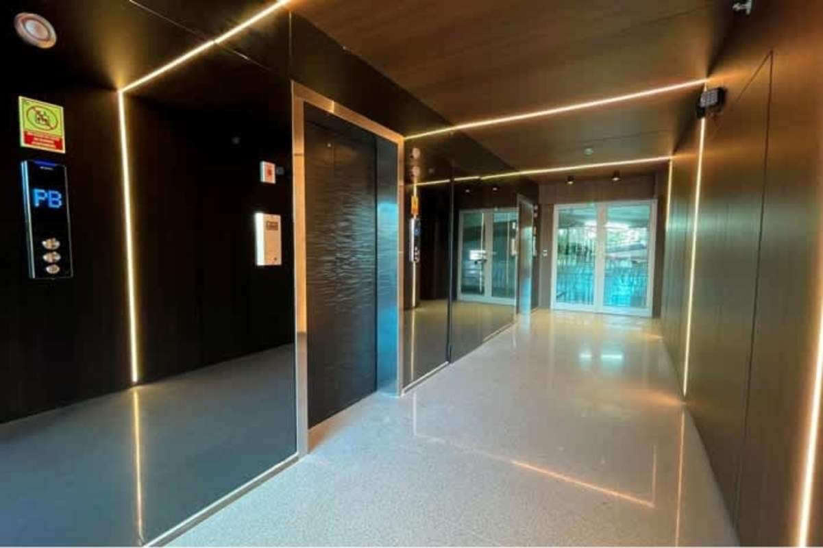 Apartment balcony with glass railing overlooking Panama City skyline in PH Bonavista