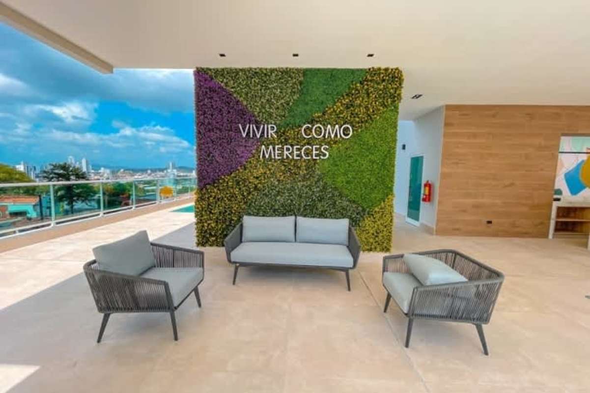 Double-height modern lobby with planters and seating in PH Bonavista Panama City