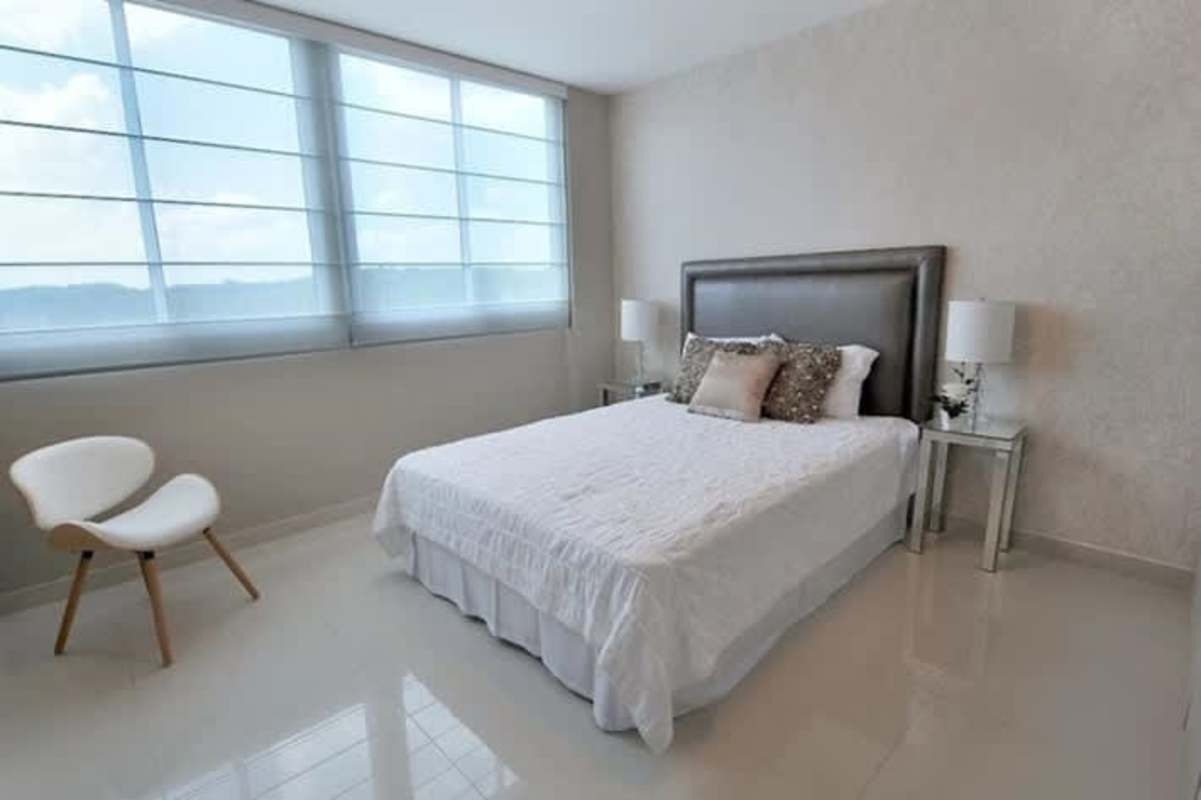 Modern minimalist bedroom with large window and neutral decor PH Mei Tower Panama