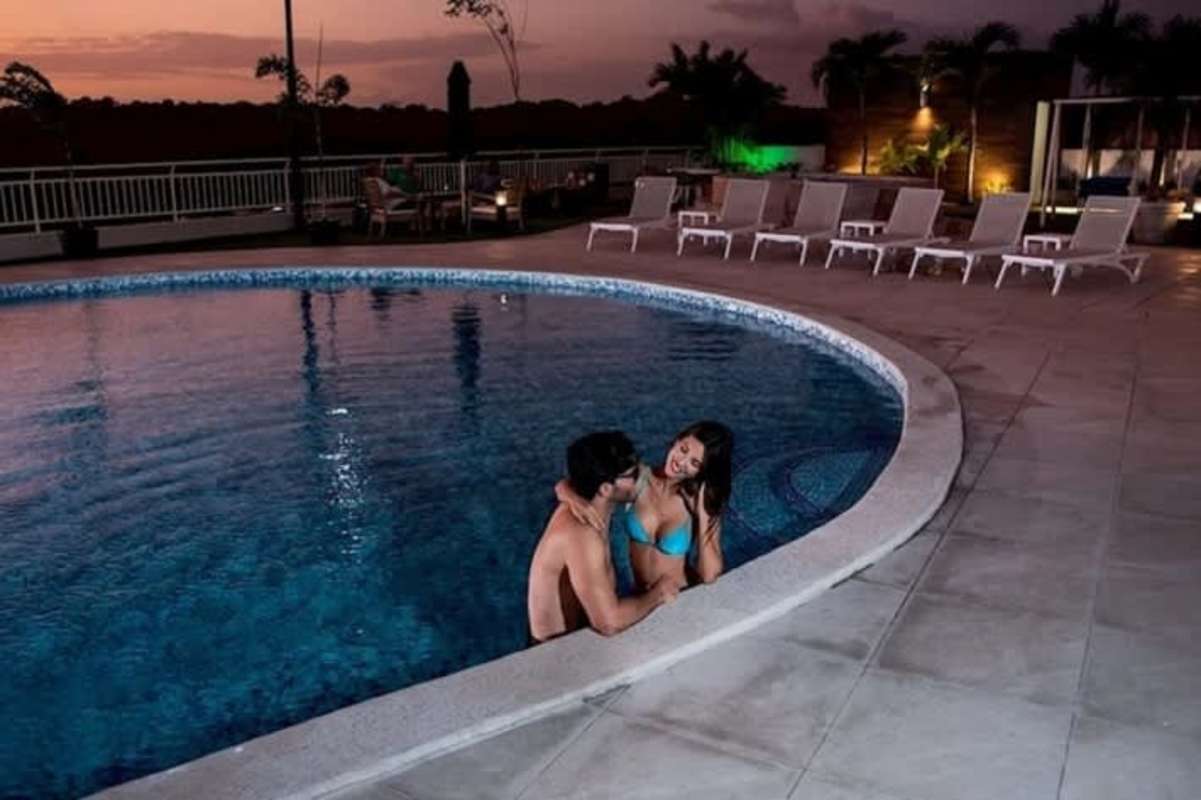 Panoramic infinity pool and lounging area at sunset PH Mei Tower Villa de Las Fuentes Panama City