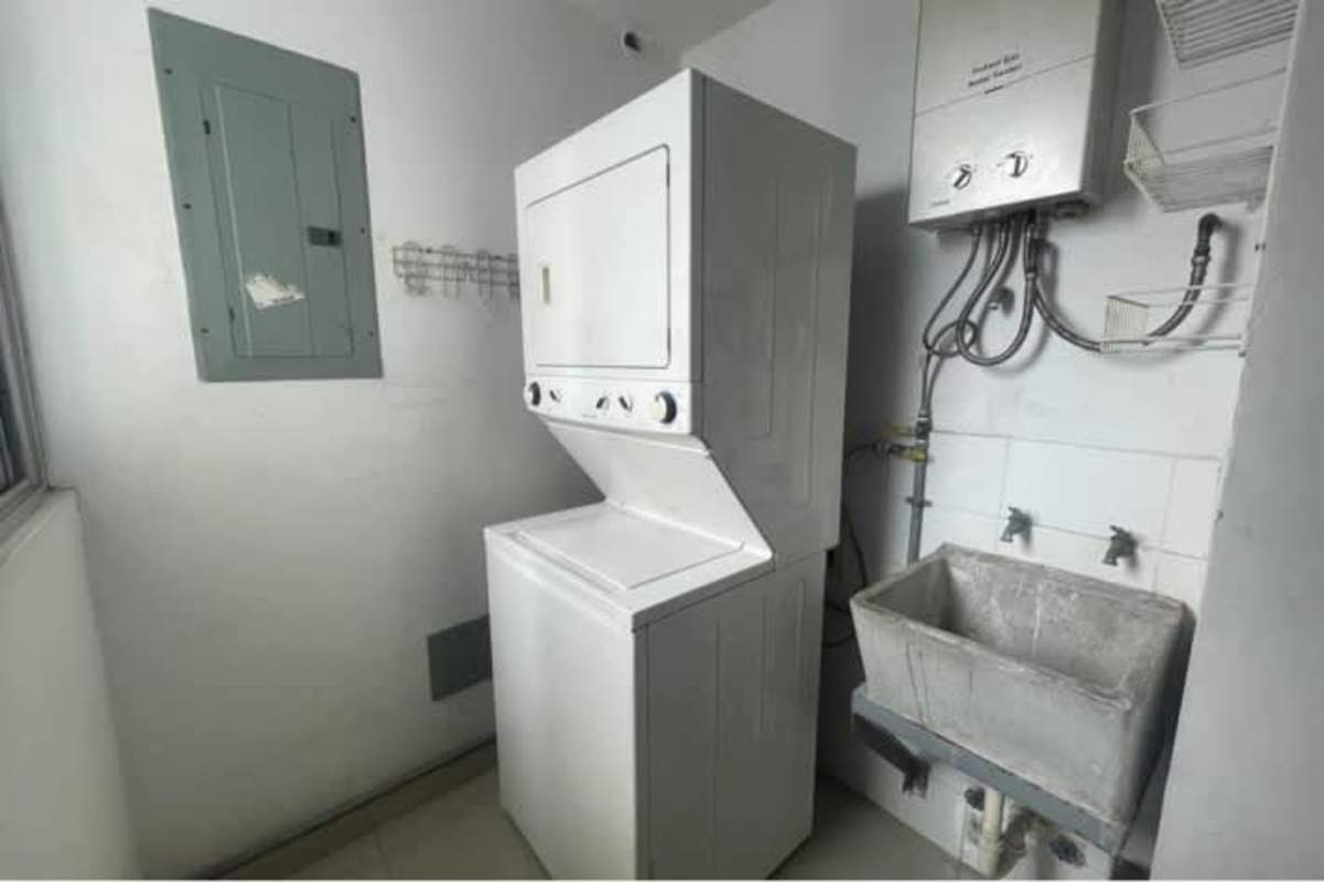 Tiled bathroom with glass shower enclosure and modern fixtures in PH Bella Vista Tower Panama City