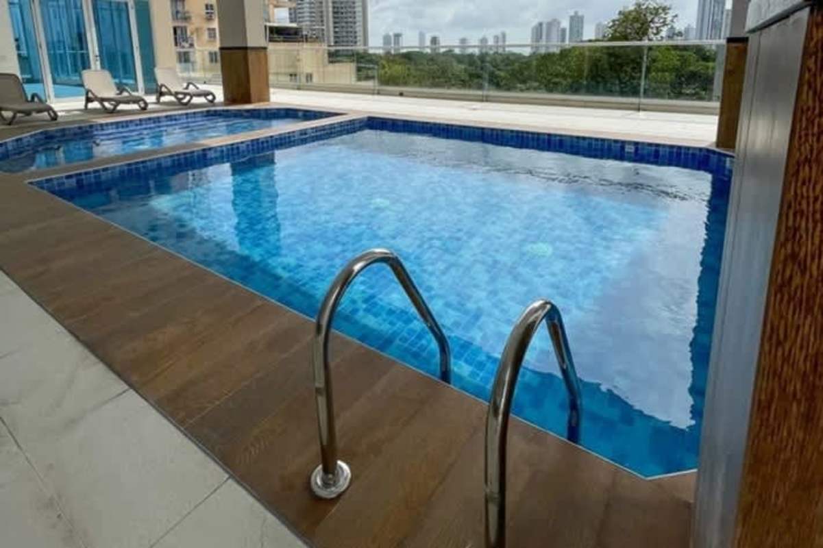 Aerial of Parque Omar green spaces with skyscraper skyline PH Isabella Towers Carrasquilla Panama