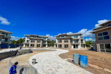 Master bedroom with large windows and terrace access in beachfront condo Chame Panama