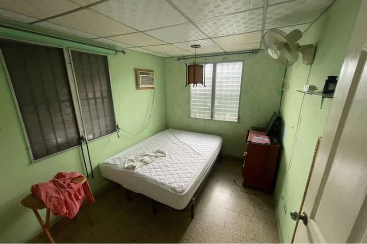 Vintage kitchen with gas stove, white cabinets, refrigerator in Villa Lucre Panama