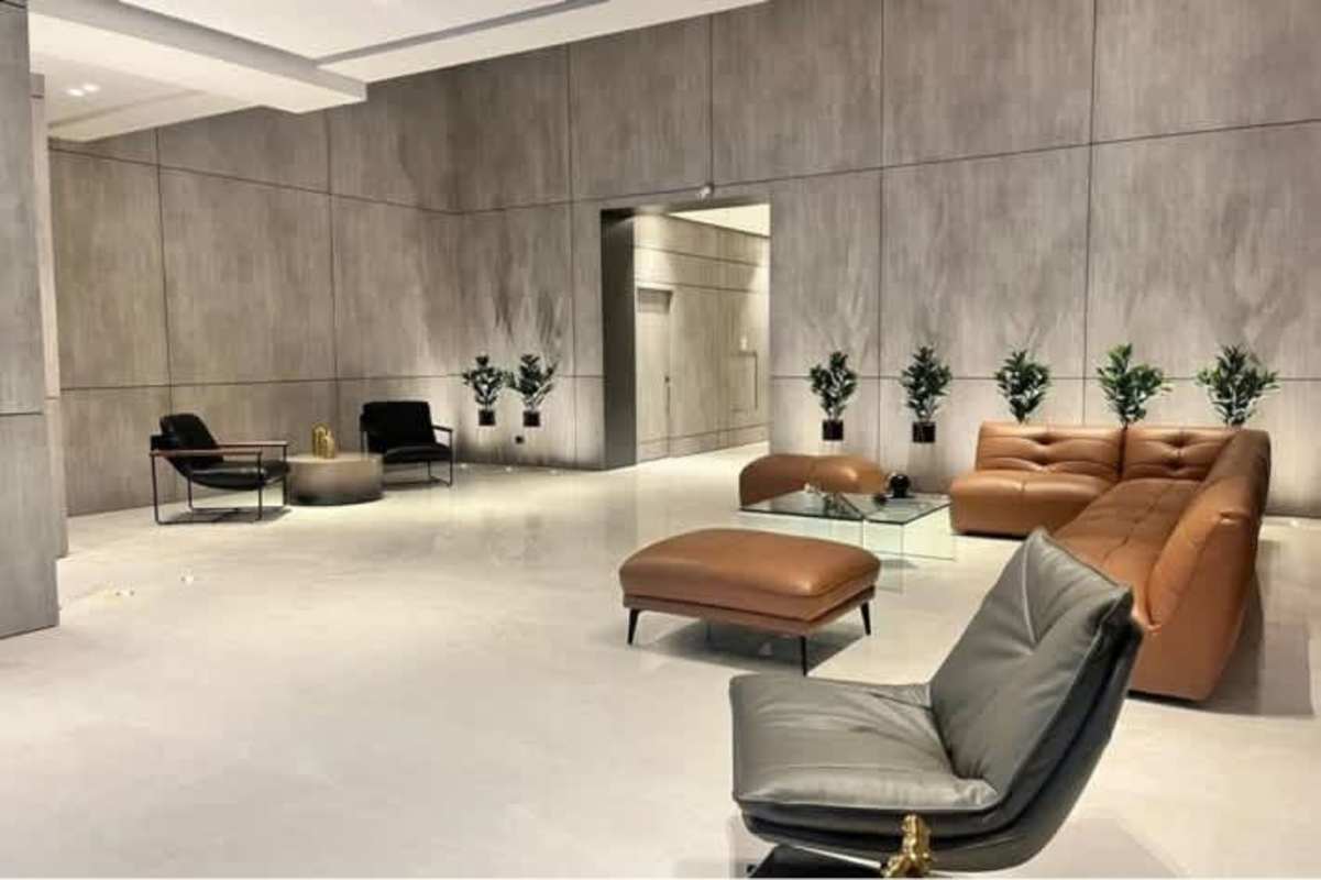 Stylish bathroom with glass shower, modern sink, tiled walls in PH Center Point Tower Panama City