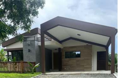 Bathroom with glass shower enclosure and neutral tiles at Terra Viva Coronado Panama
