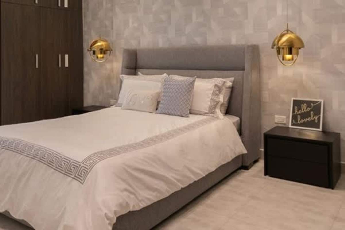 Spacious living room floor-to-ceiling windows mountain city views Condado Gardens Panama