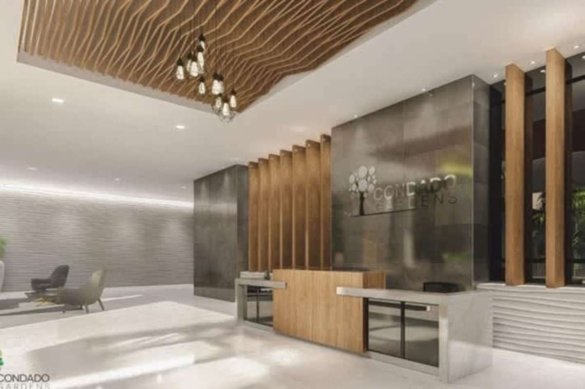 Modern condominium lobby wood marble finishes reception Condado Gardens Panama