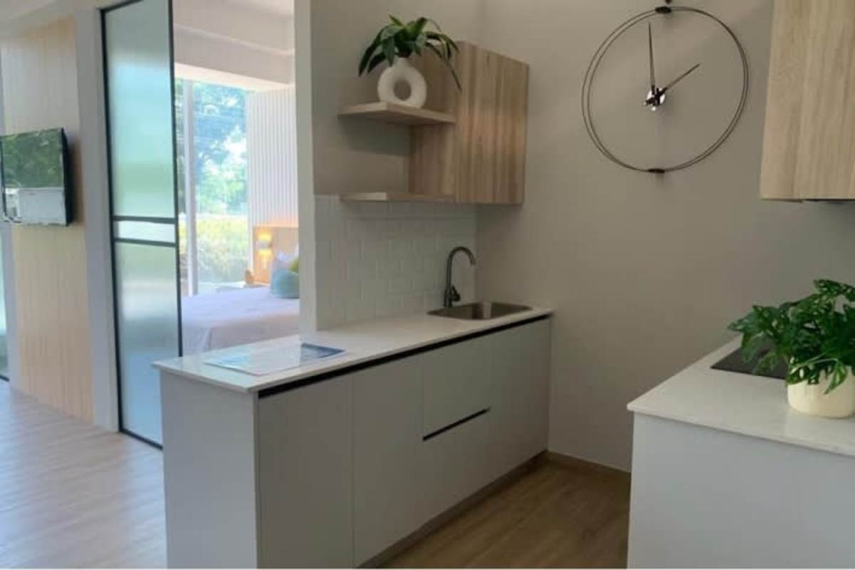 Modern kitchen white cabinets quartz countertop PH Seaside House Avenue Balboa Panama