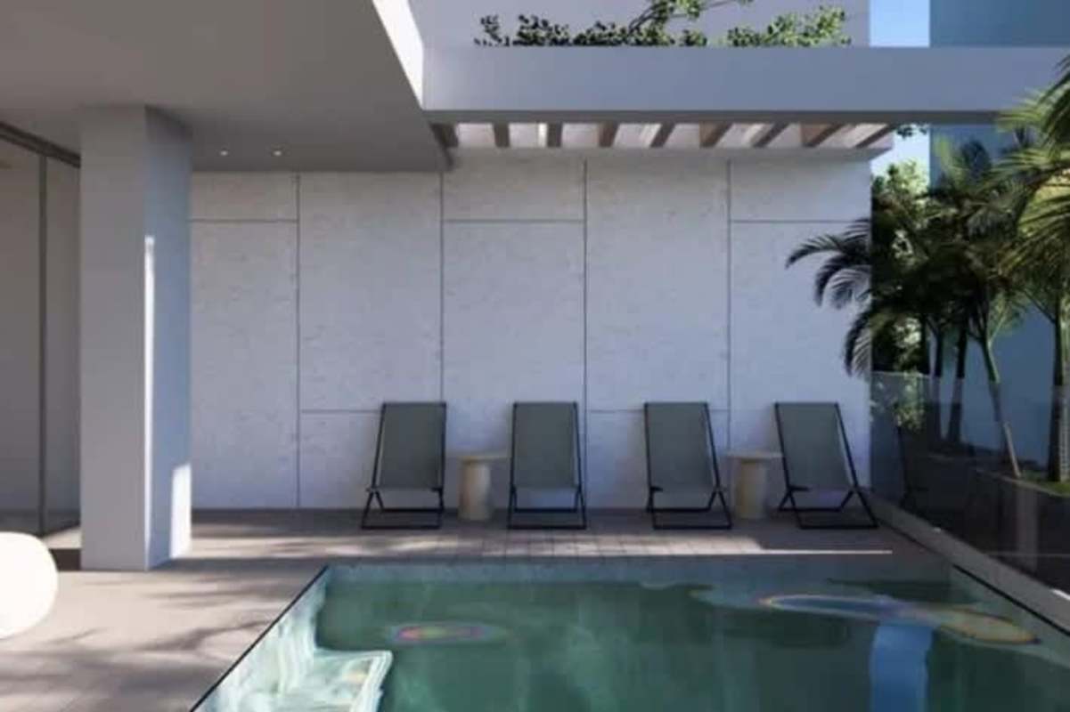 Infinity rooftop pool with skyline panorama, lounge chairs pergola PH The Edge Panama City