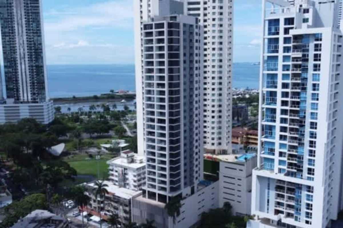 Modern high-rise towers with ocean backdrop at PH Prestige Bella Vista