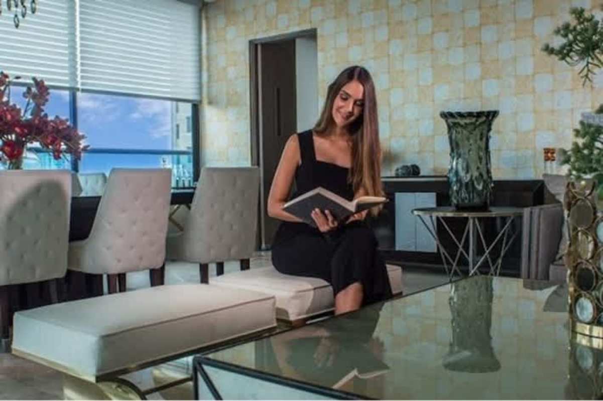 Open living-dining space with large windows and sea view in PH Deluxe Residences Punta Paitilla Panama