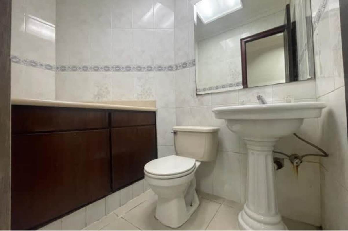 Office bathroom with sink, mirror, and cabinet PH BICSA Avenue Balboa