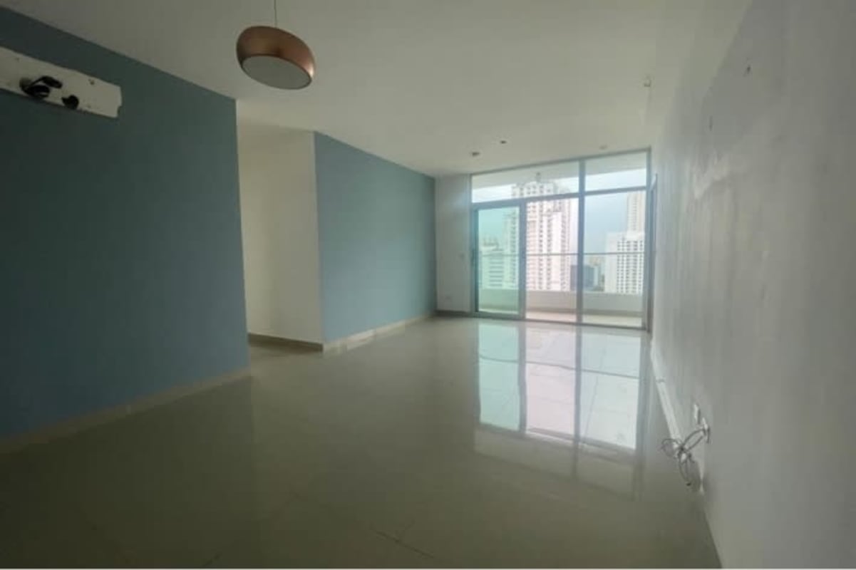 City view living/dining space with large windows and glossy tiles in PH San Francisco Park Panama