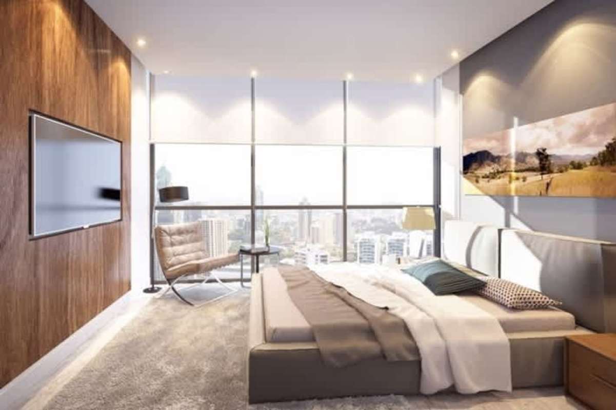 Modern master bedroom floor-to-ceiling windows oceanfront luxury apartment in Panama