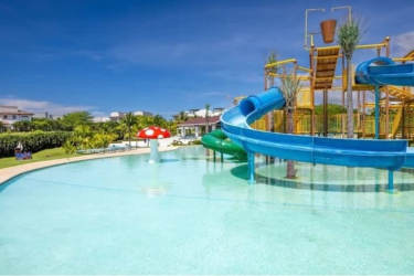 Tropical beachfront gazebo shaded by palm trees with ocean view Royal Villas Panama