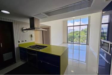 Dining space beside sliding doors to balcony in River Valley Panama Pacifico apartment