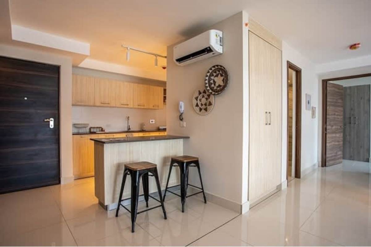 Bright open living dining space with panoramic windows balcony view in PH Isabella Towers Carrasquilla