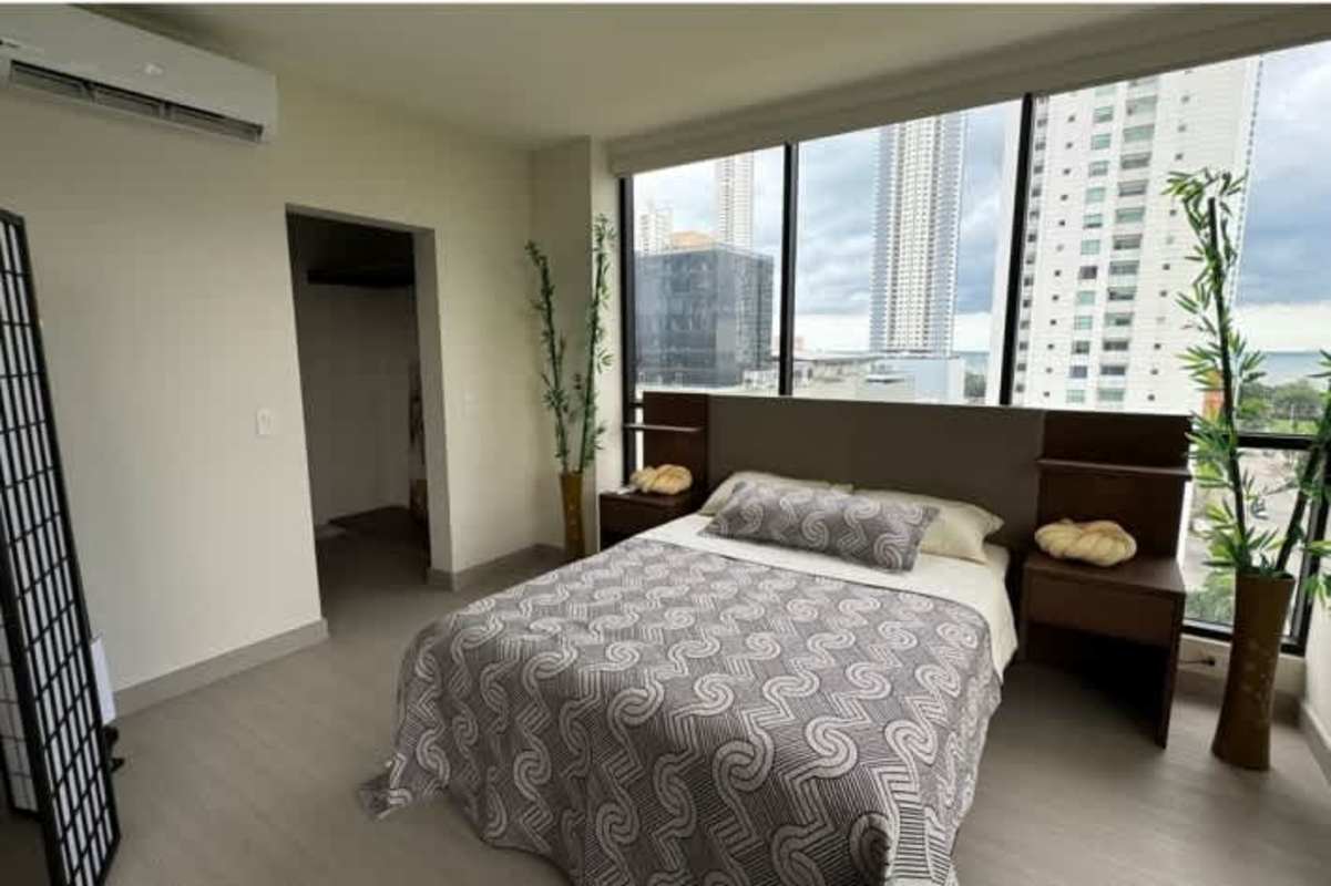 Bright master bedroom panoramic windows city view PH Arcadia Costa del Este Panama