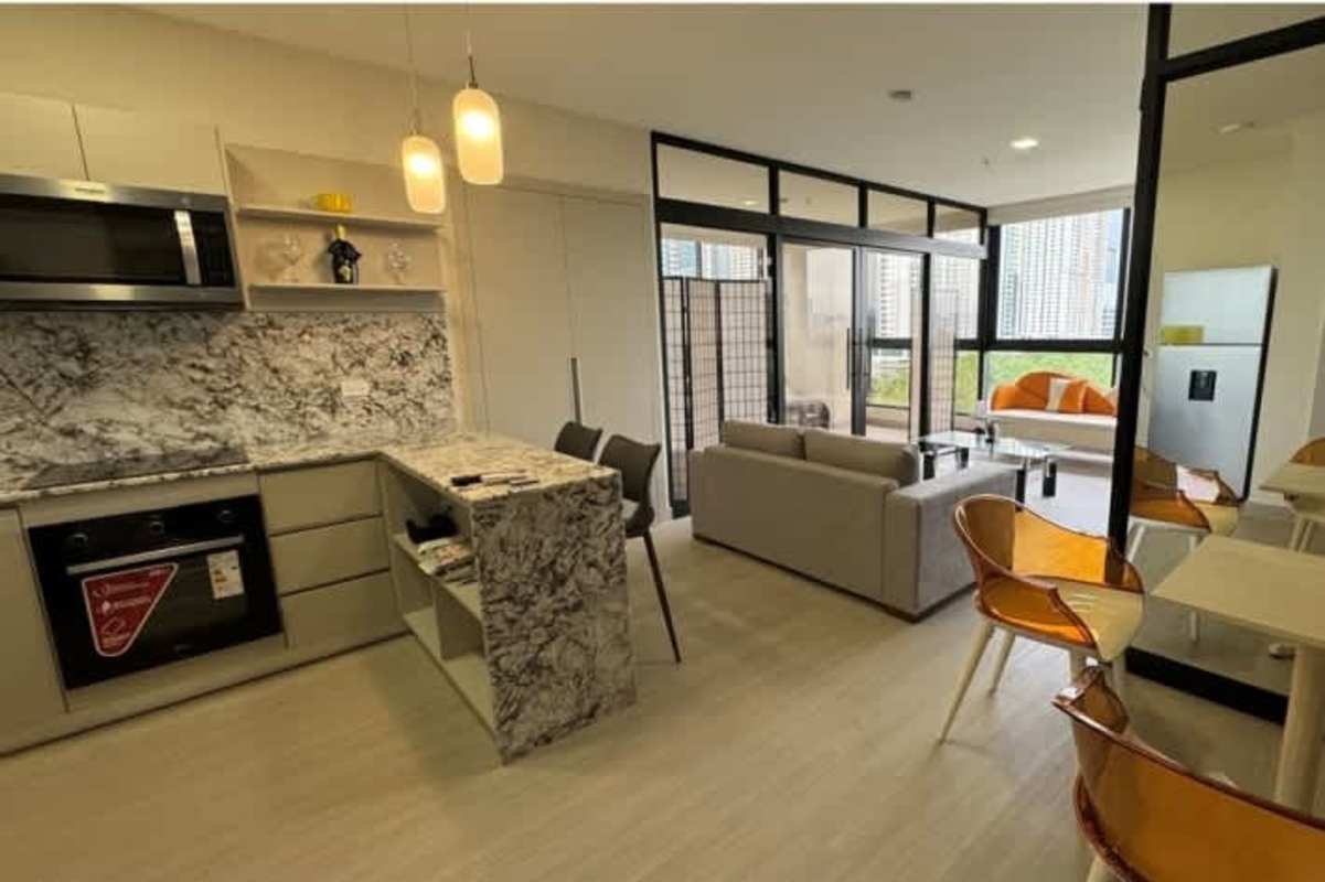 Integrated kitchen and dining with modern finishes in Arcadia Costa del Este Panama