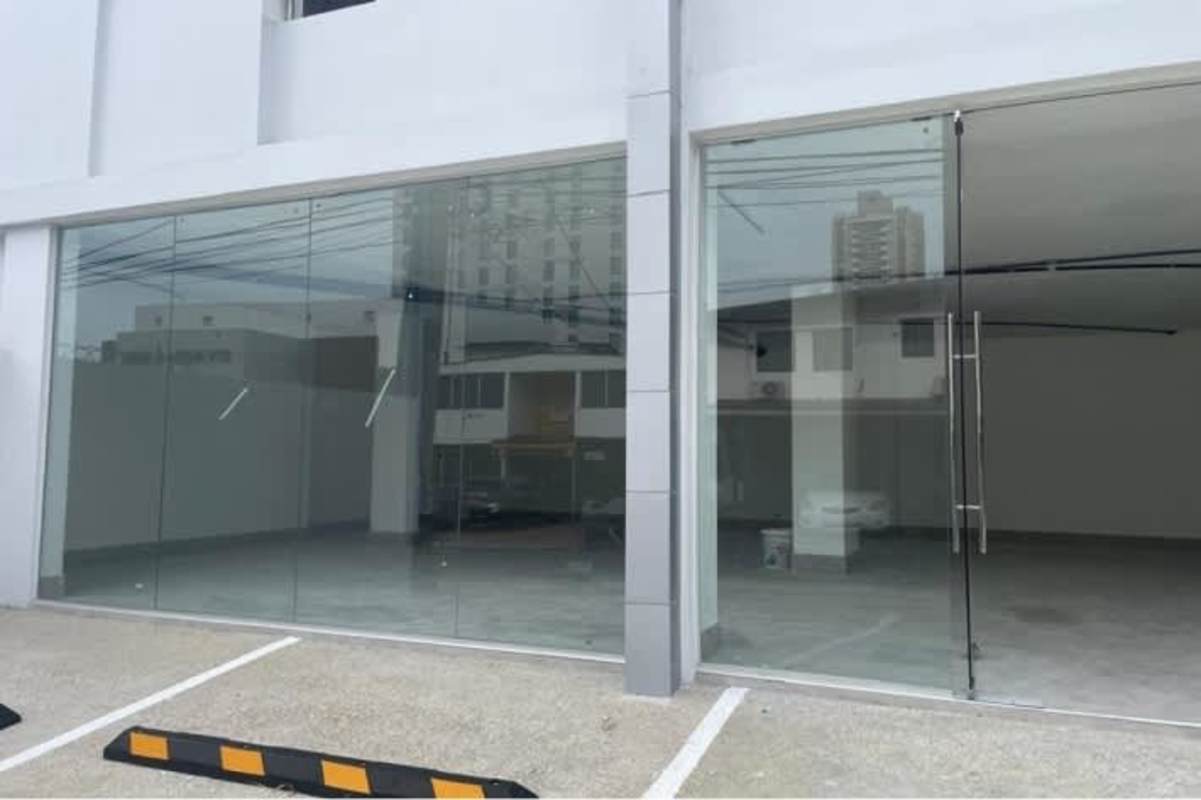 Minimalist white-tiled bathroom inside commercial unit for rent in San Francisco Panama