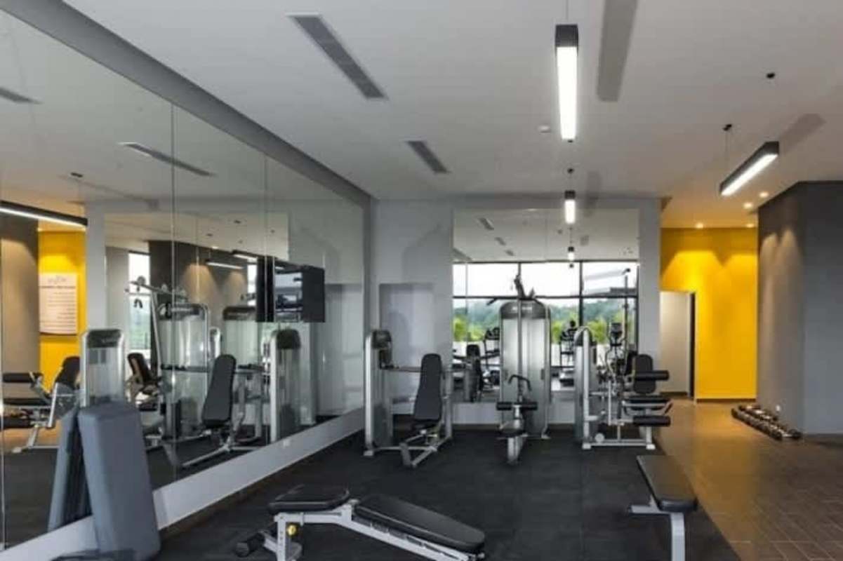 Modern gym with cardio and weight equipment in PH Portofino Tower Betania Panama