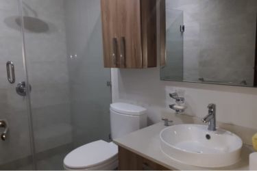 Updated bathroom with glass shower enclosure in PH River Valley Panama Pacifico