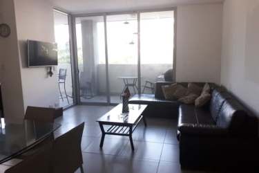 Bright living dining area open to terrace at PH River Valley Panama Pacifico