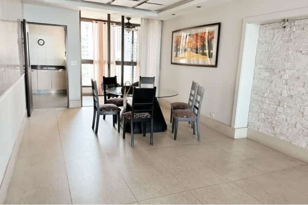 Renovated kitchen with granite countertop wood cabinets at San Francisco Bay Tower 400 Panama City