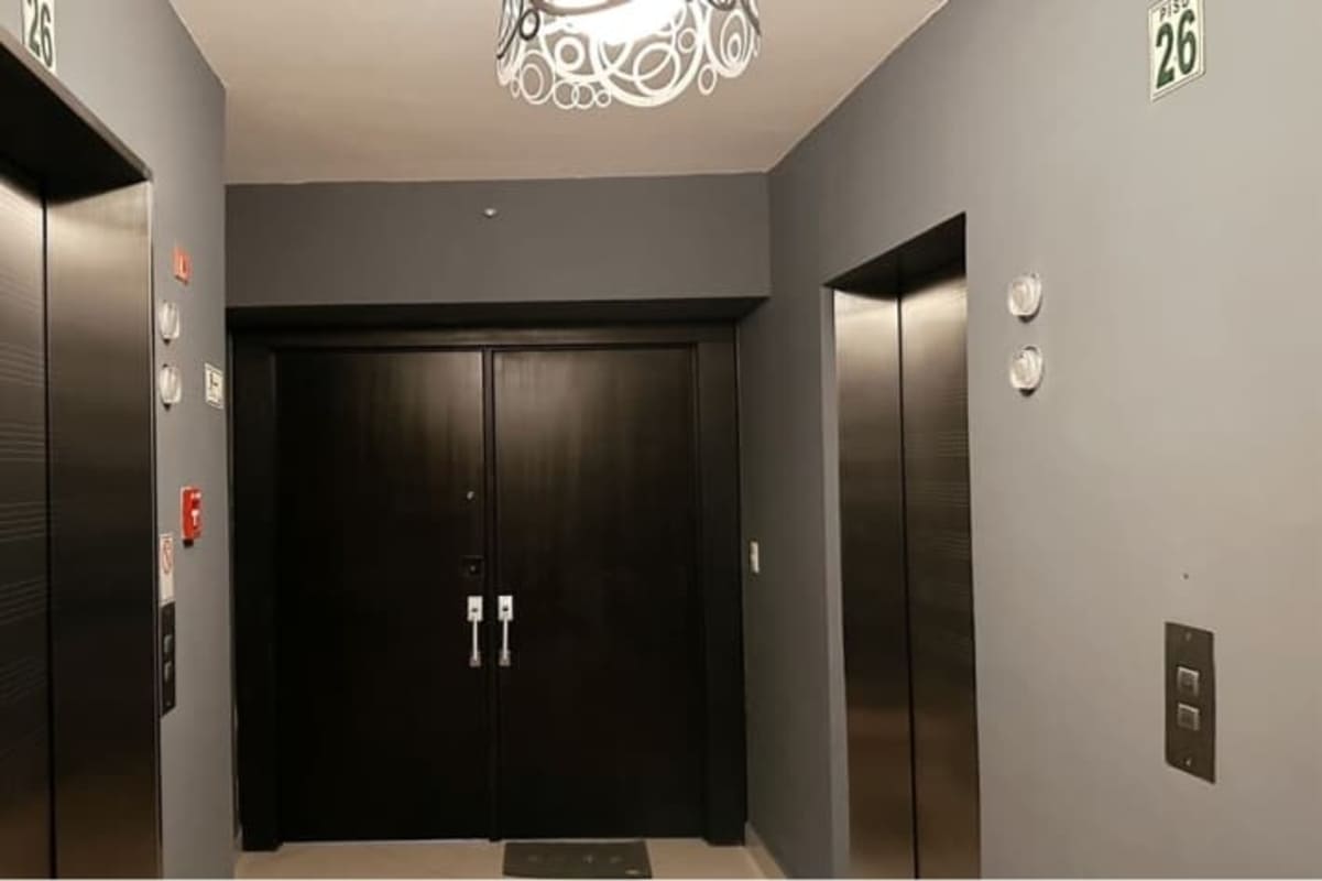 Modern bathroom with glass-enclosed shower granite counter in San Francisco Bay Tower 400 Panama