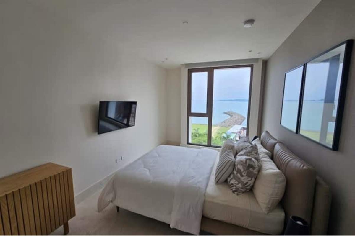 Fully equipped designer kitchen with island and quartz countertops at Ocean Reef