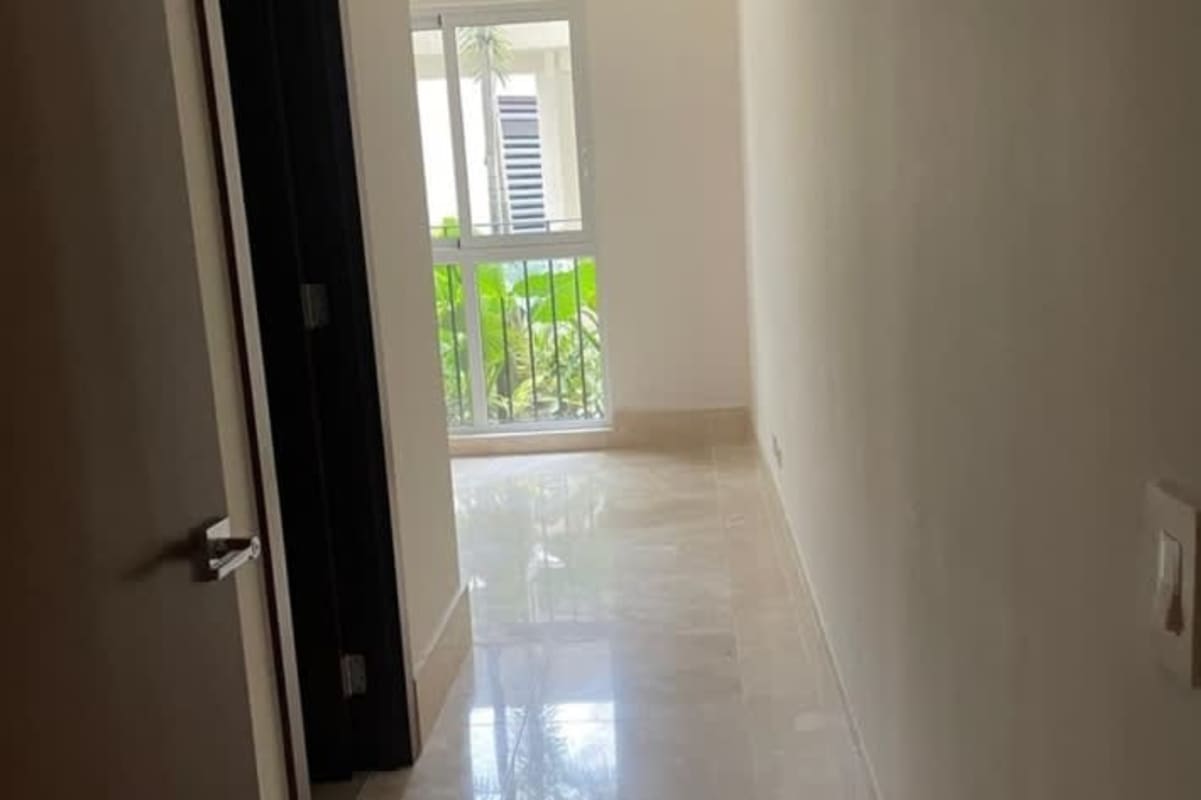 Contemporary open concept living room with large windows and marble flooring in Santa Maria Panama