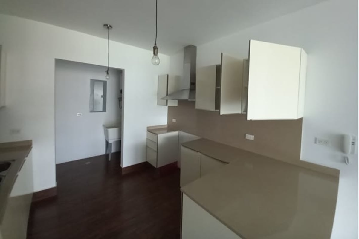 Covered balcony overlooking pool and gardens at PH Costamare Costa Sur Panama