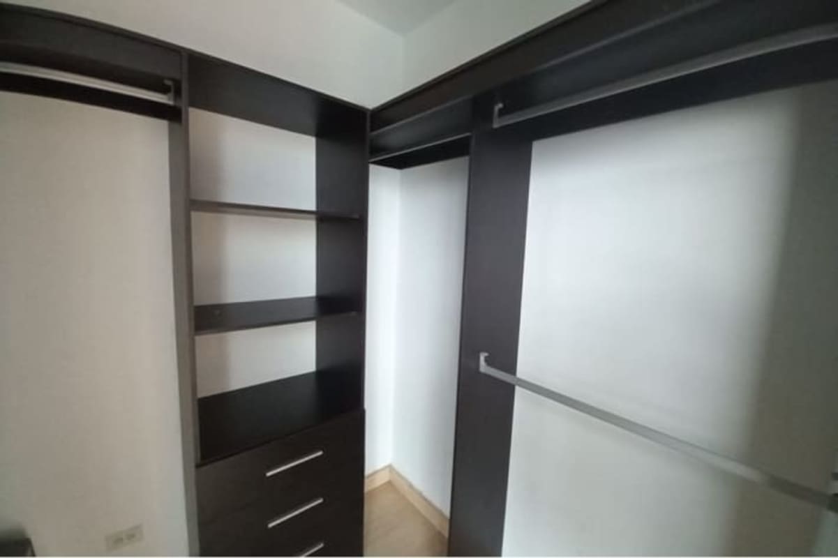 Large living room with floor-to-ceiling windows offering skyline view in The Forum Panama