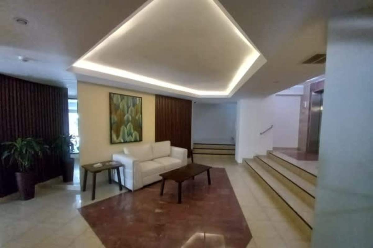 Spacious kitchen with wood cabinetry tile backsplash PH Chaquira Panama