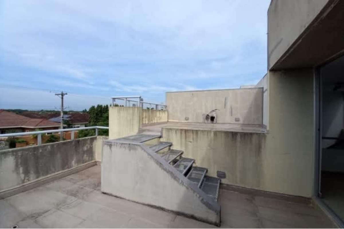 Private rooftop terrace with stairs and open sky in Costa Sur Village Panama foreclosure