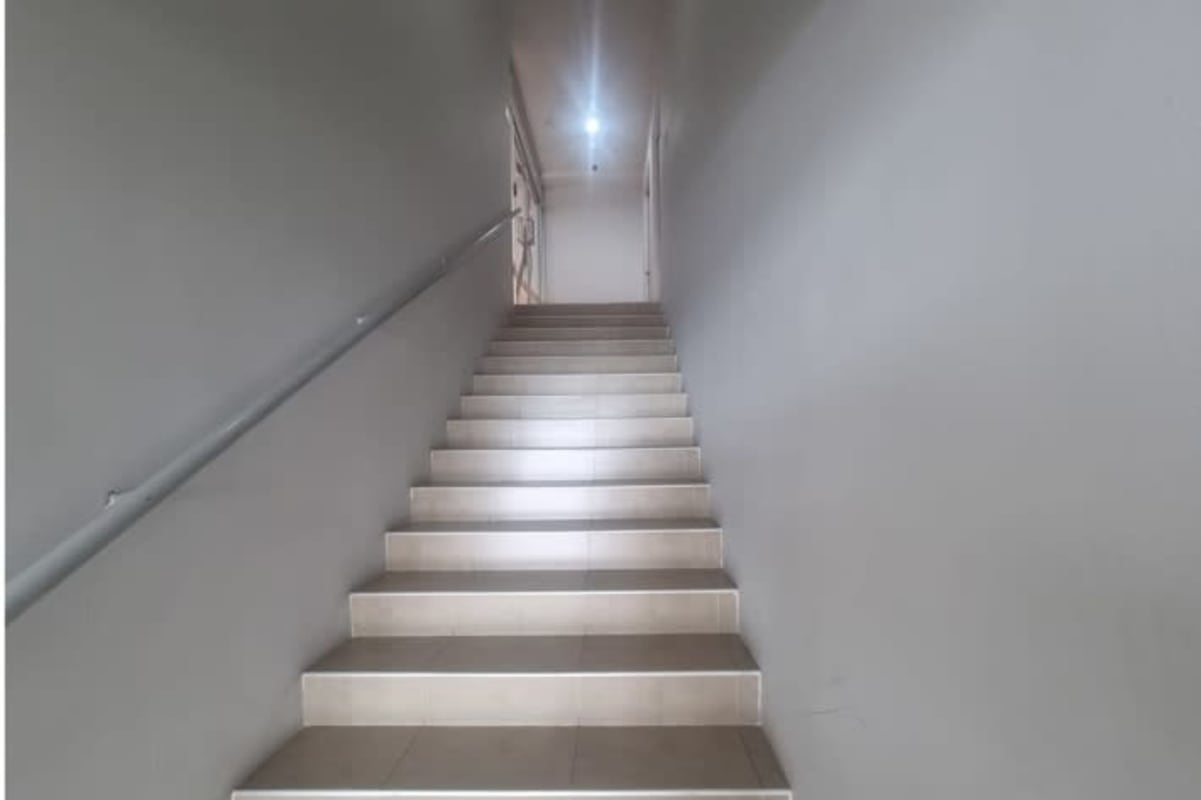 Contemporary kitchen with granite countertops and wood cabinets foreclosed property Panama