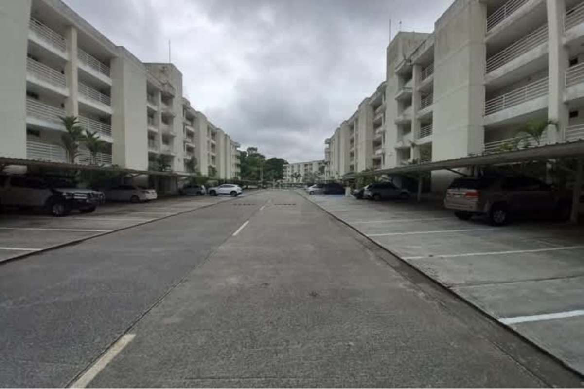 Exterior of PH Altamira Gardens with parking lot and landscaped gardens Panama City