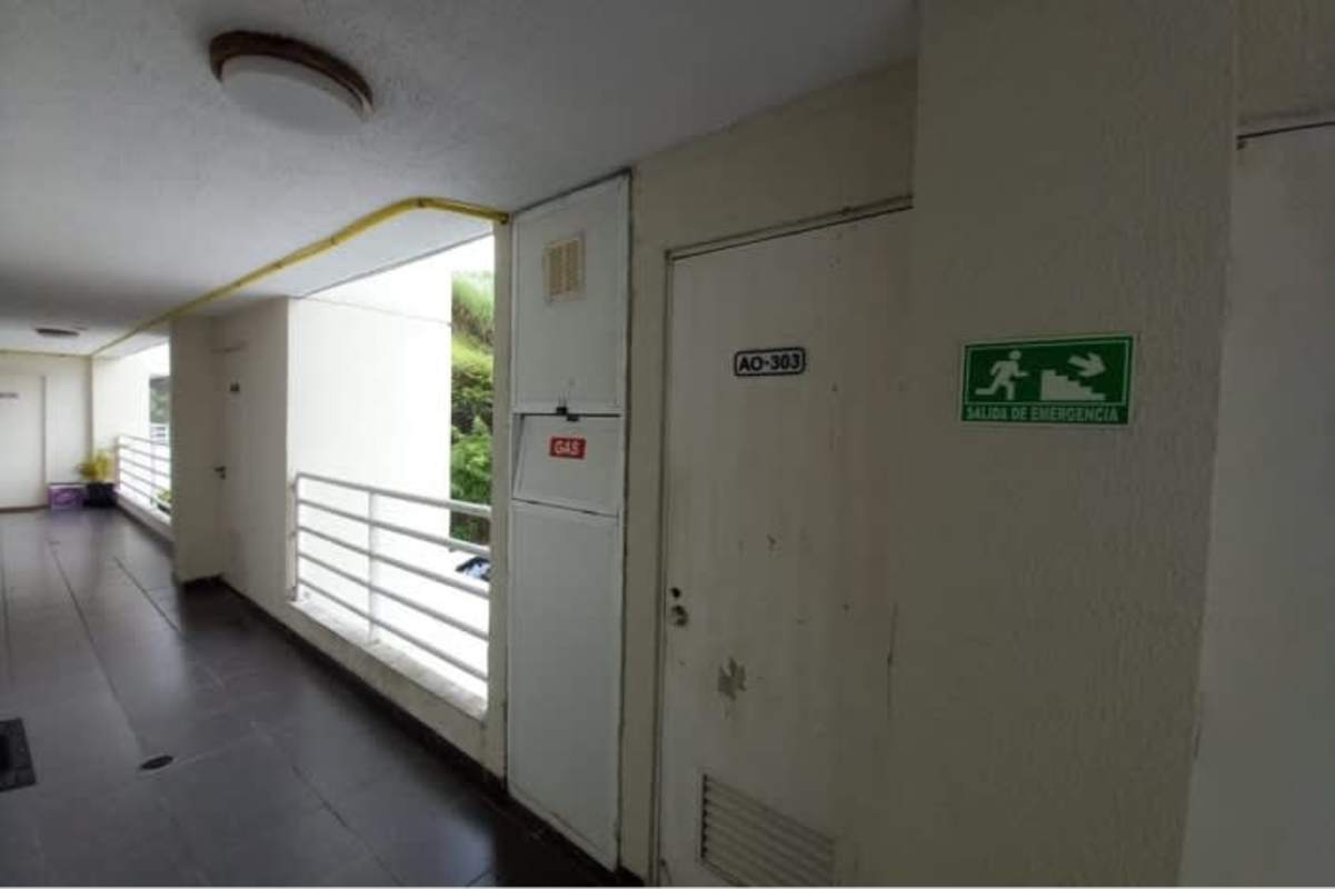 Apartment hallway with secure entry doors at PH Altamira Gardens Panama City