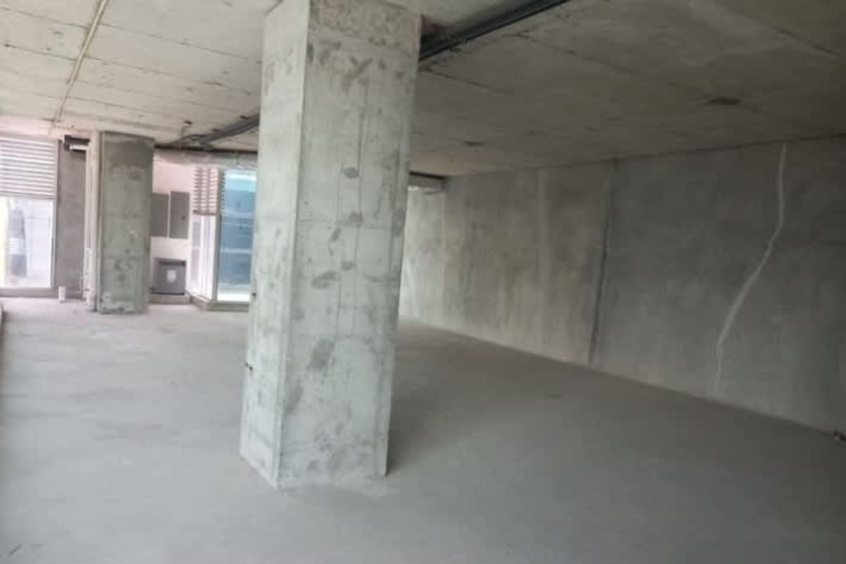 Unfinished office with large floor-to-ceiling windows overlooking downtown Panama in PH Atrium Tower Obarrio