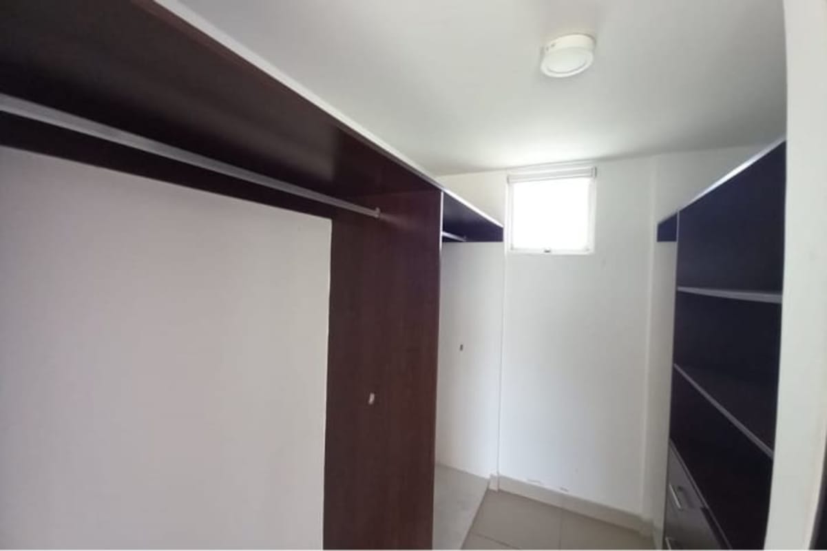 Kitchen with cabinetry and granite countertops Costa Sur Village Panama City home