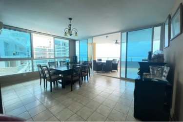 Kitchen with granite countertops, wooden cabinets and appliances with ocean view in Penthouse Playa Serena