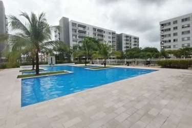 Swimming pool surrounded by greenery at PH Midrise Panama Pacifico