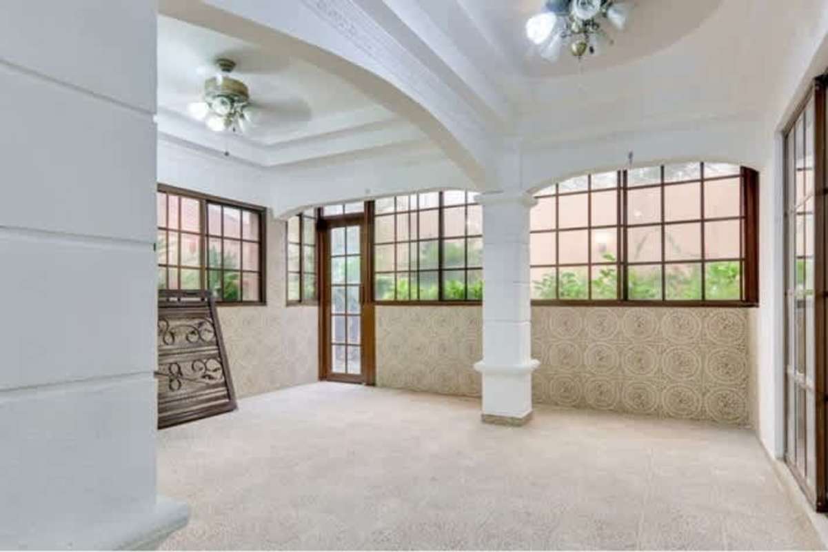 Living room with sliding doors with garden view duplex house in Versalles 1 Costa Sur Panama