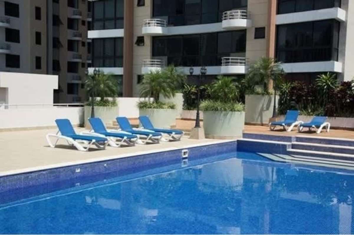 Outdoor pool space with lounge chairs and sundeck PH San Francisco Bay Tower E Panama City