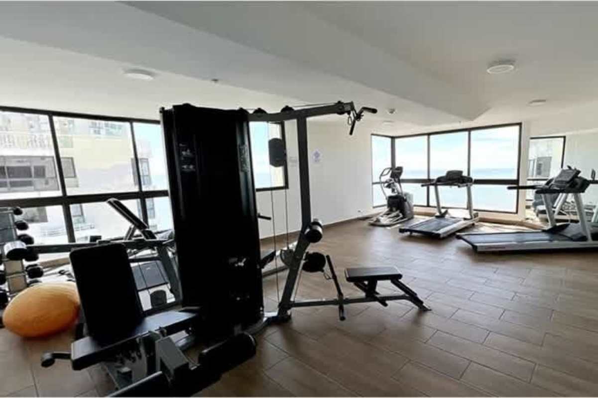 Modern gym with ocean views large windows fitness equipment San Francisco Bay Panama