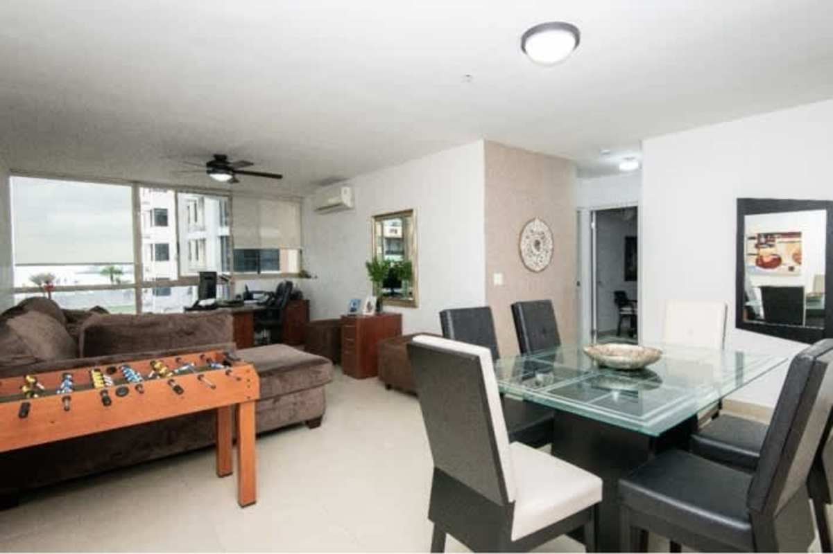 Bright living dining space with large windows ceiling fan PH San Francisco Bay Panama City